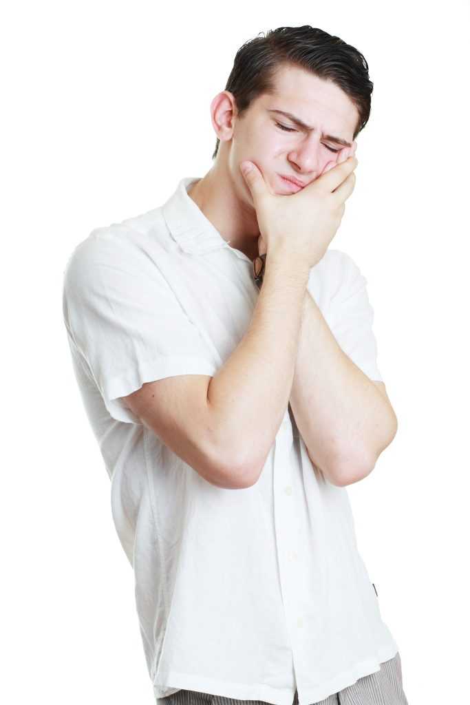 A Young Man Experiencing Dental Pain