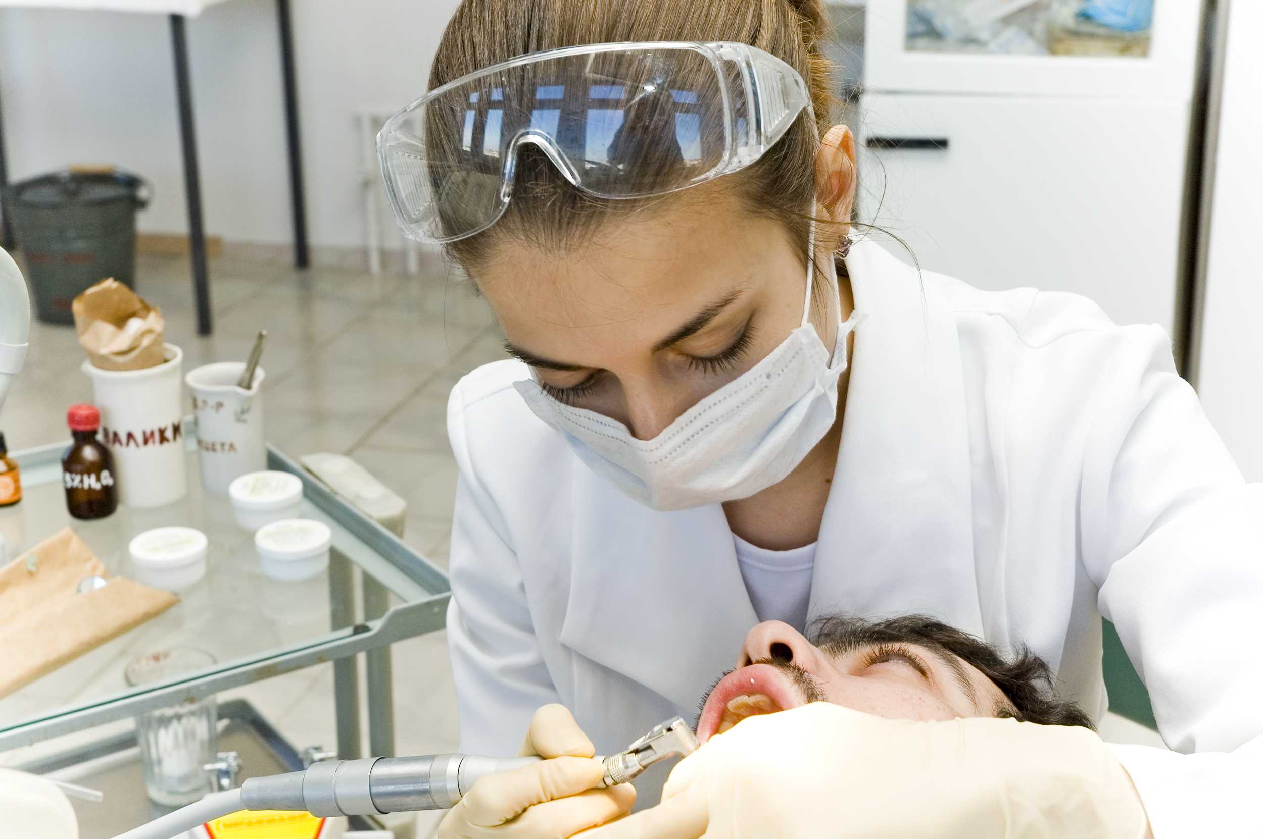 doctor performing dental surgery