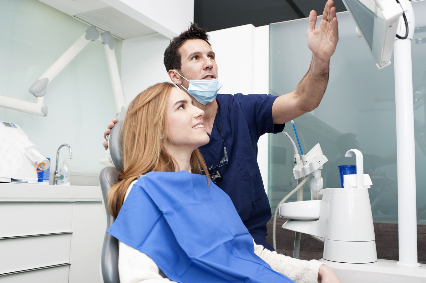 a dentist explaining denta results with a patient