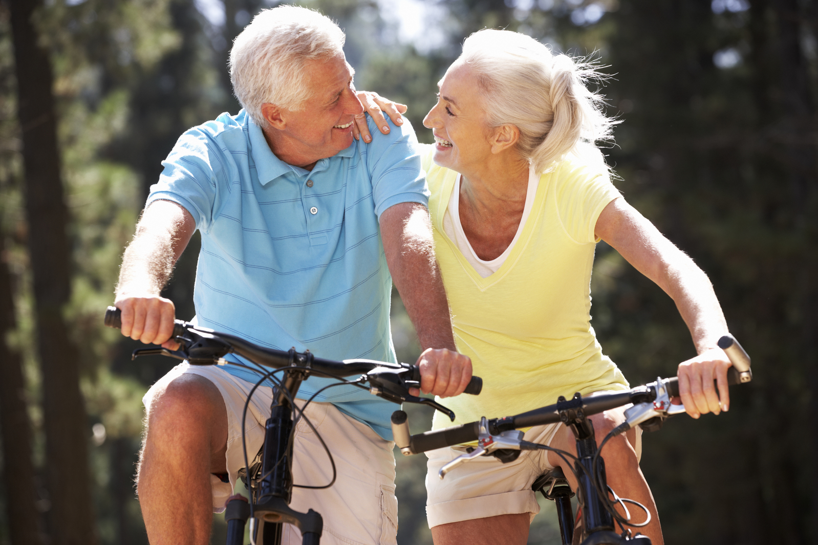 Retiree couple riding bicycles