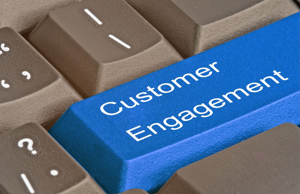 keyboard with words customer engagement