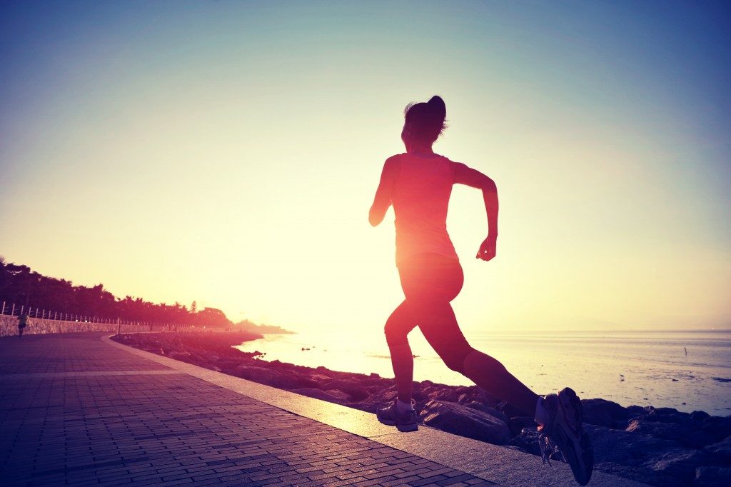 woman jogging at daybreak