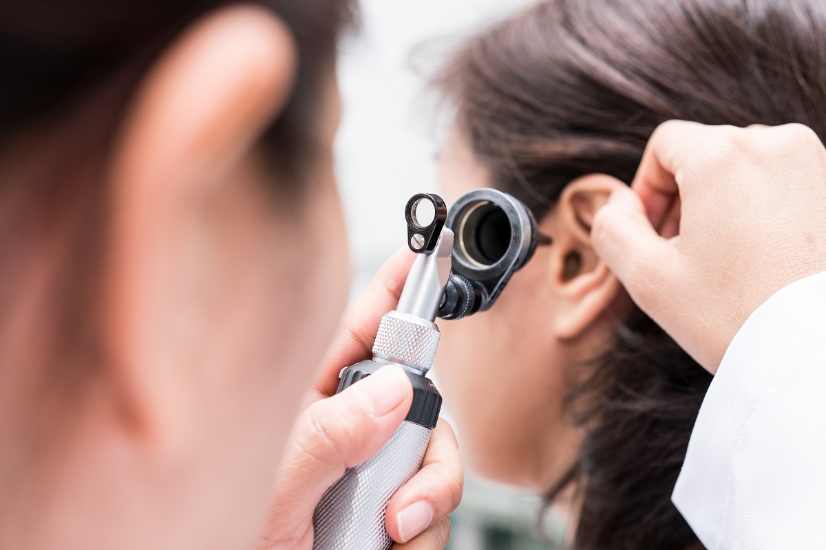 Doctor examining a patient's ear