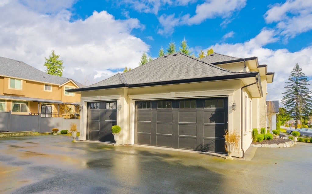 a concrete driveway and garage