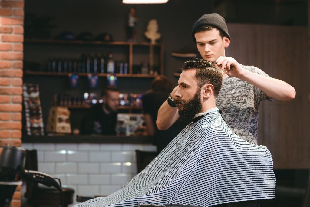 barber styling bearded man