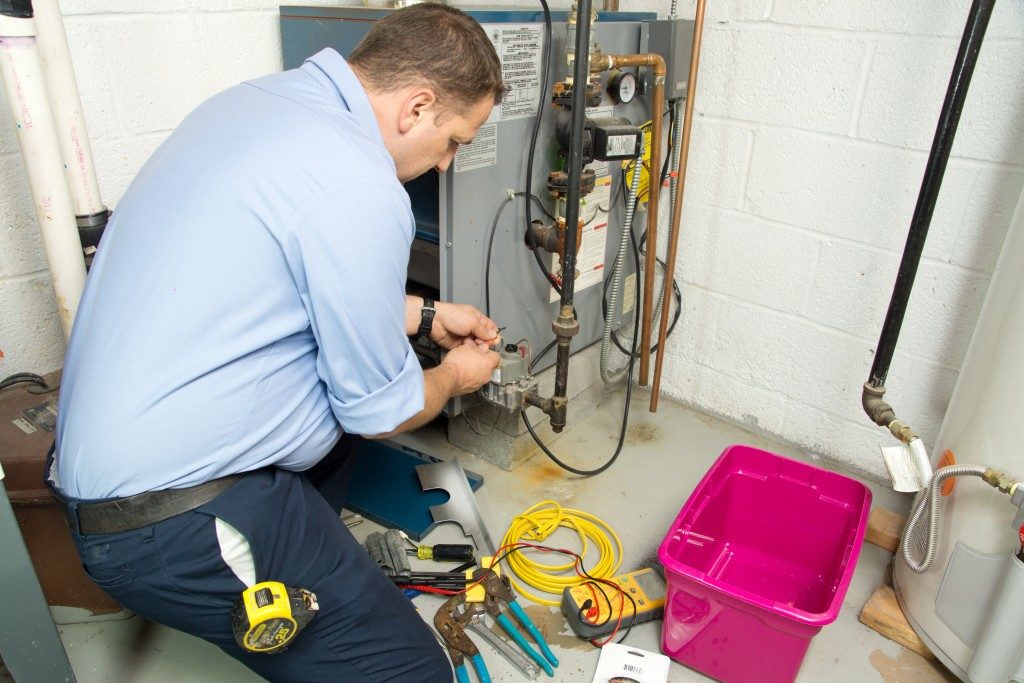 Man fixing furnace