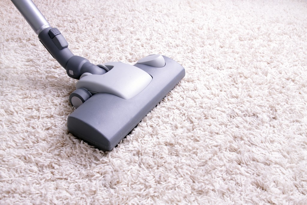 vacuumming the carpet