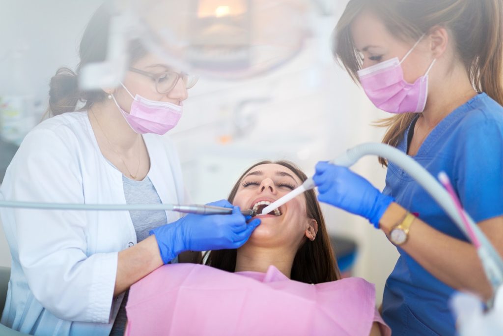 woman in dental clinic getting her teeth treated