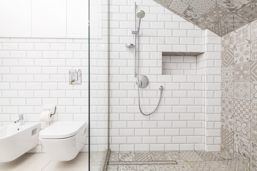 bathroom with white and decorative tiles