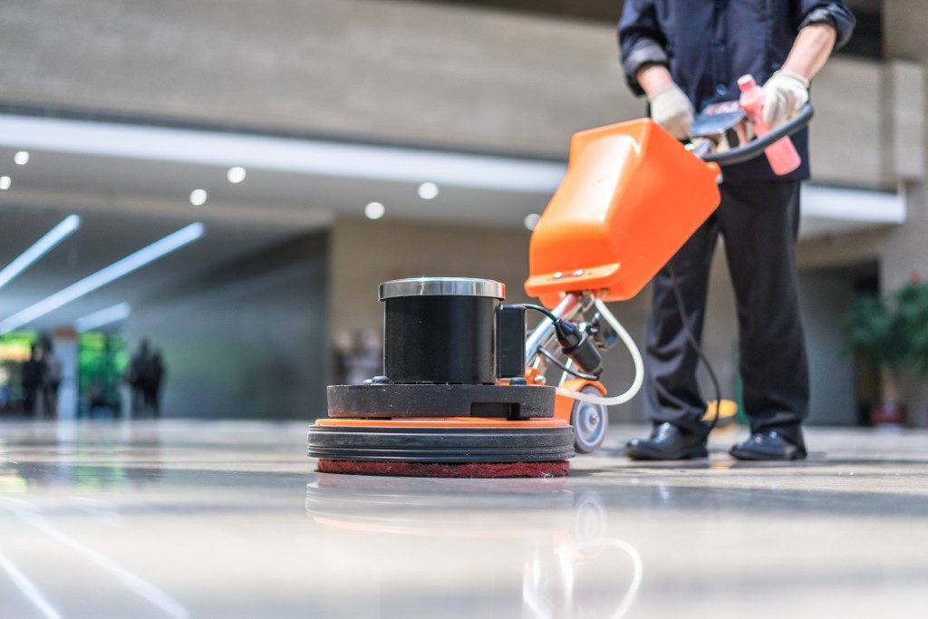 cleaner polishing the floor