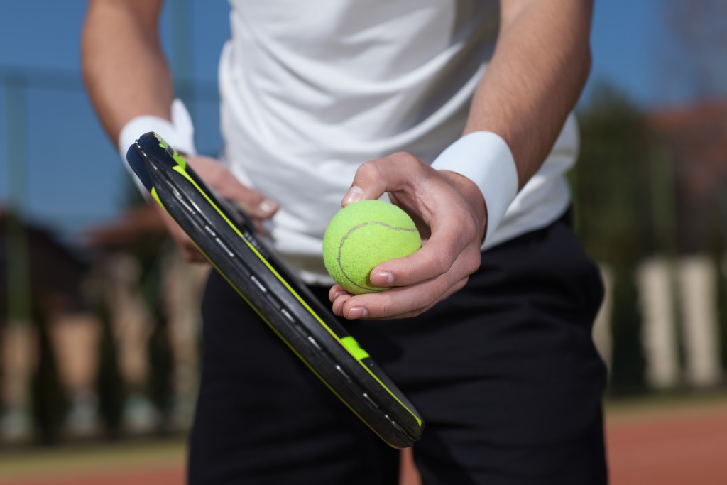 close up shot of a tennis player about to hit the ball
