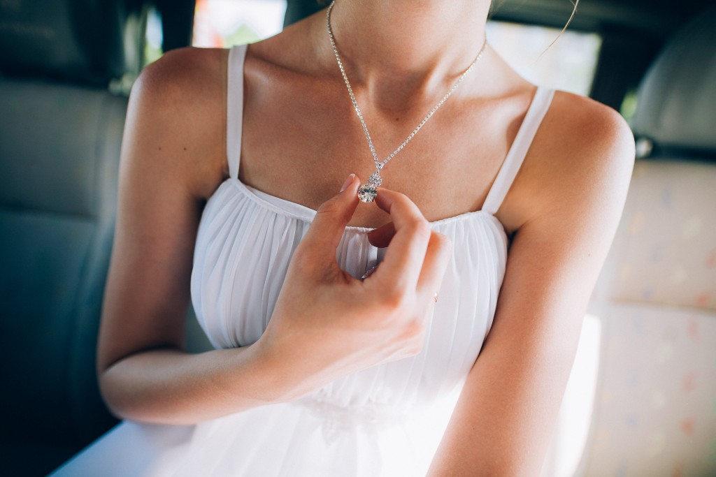 woman wearing a diamond necklace