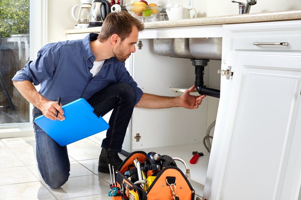 plumber checking the sink