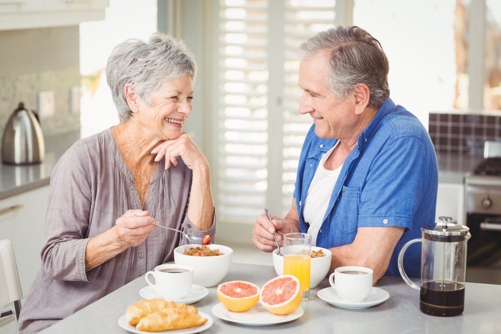 elderly couple having breakfast