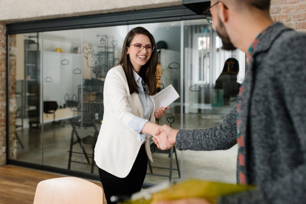 applicant shaking hand of interviewer