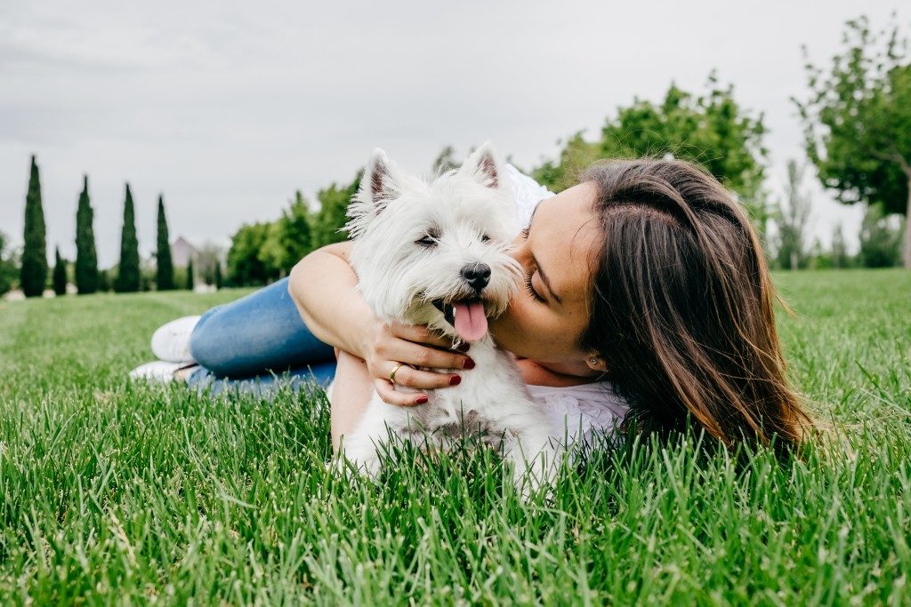 woman playing with her dog