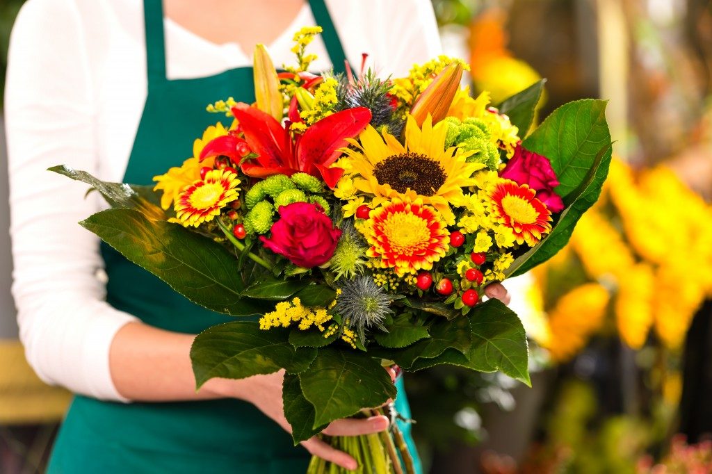 Florist holding bouquet