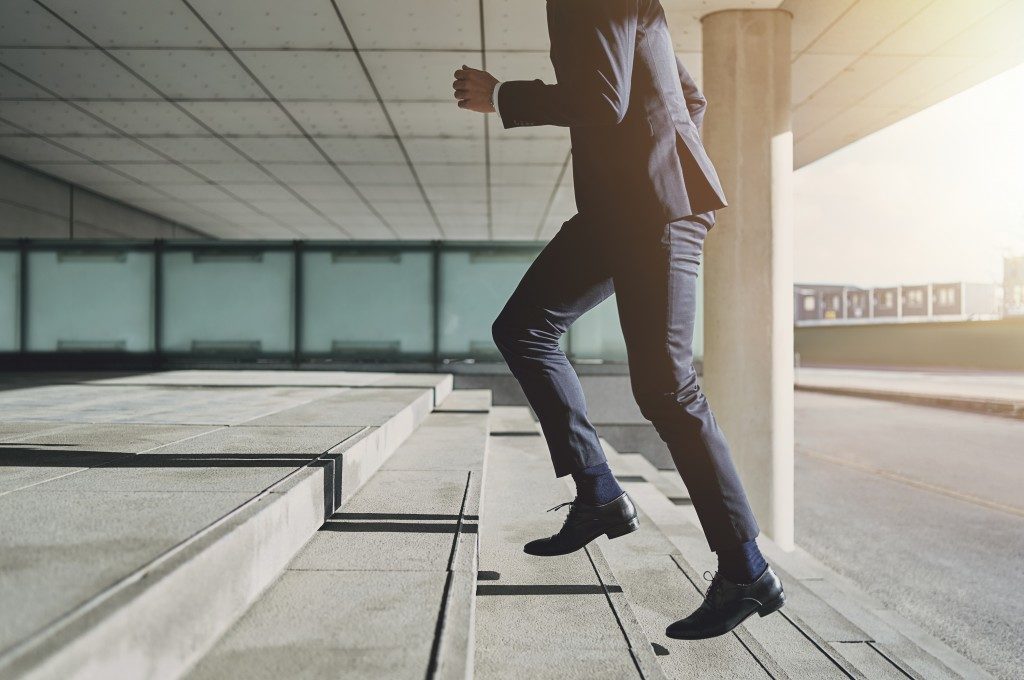 businessman going up the steps