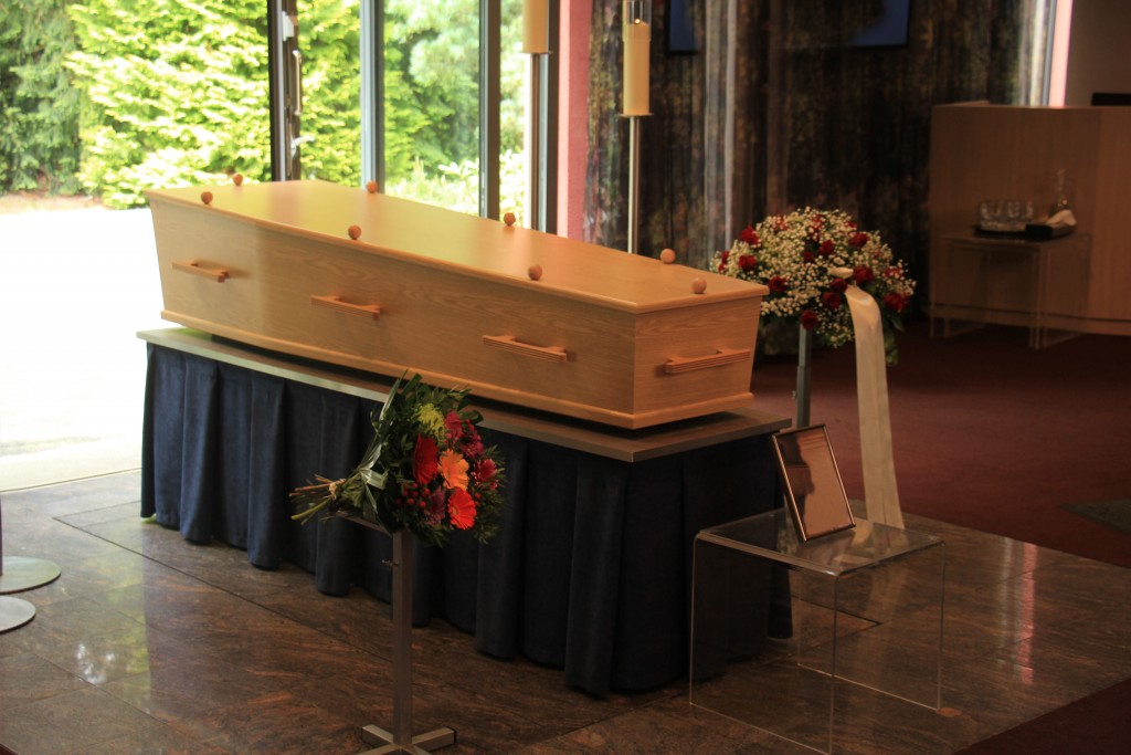 wooden casket in a funeral home