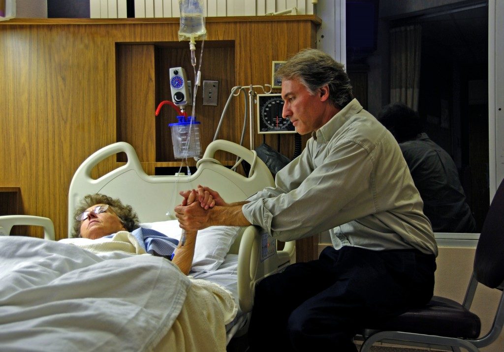 man holding his loved one's hand