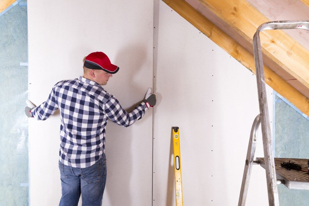 man working on home improvement