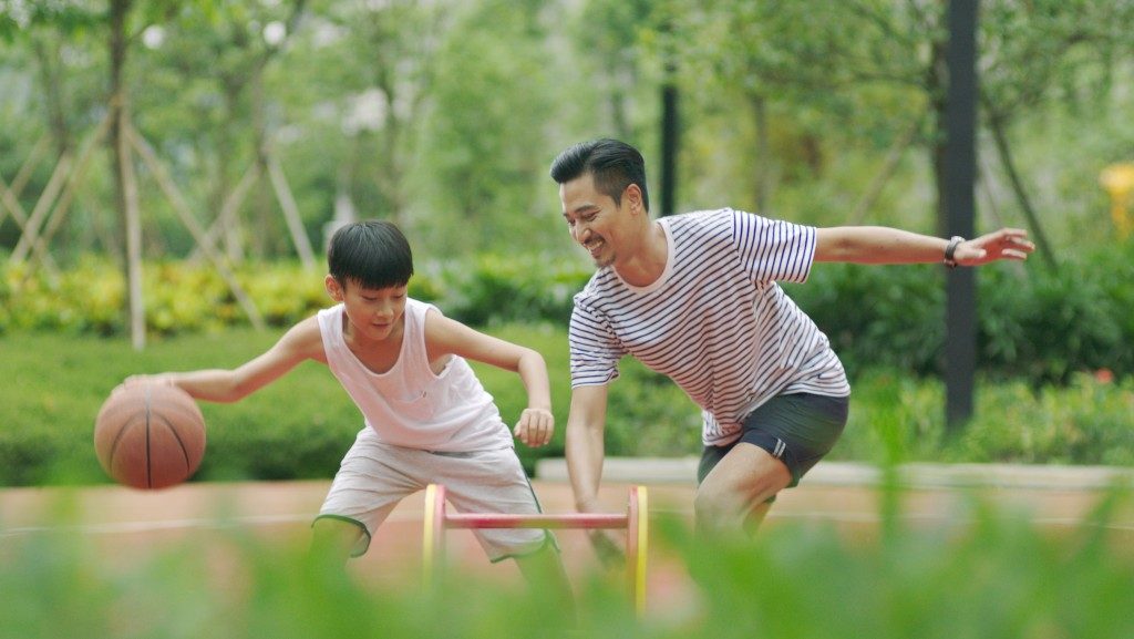 father and son playing ball