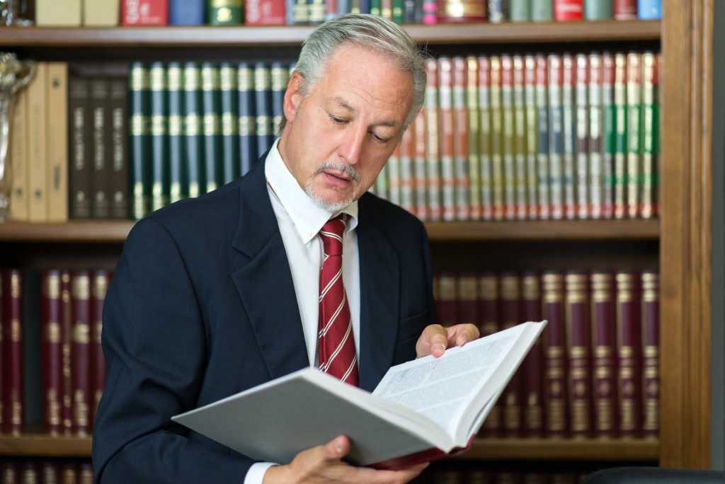 lawyer reading a book in the library