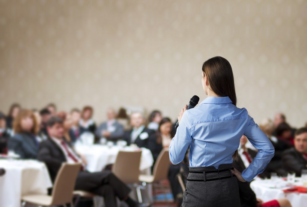 woman speaking in a business conference