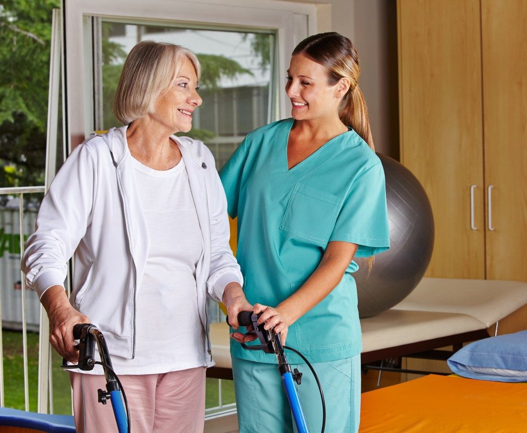 nurse assisting a senior