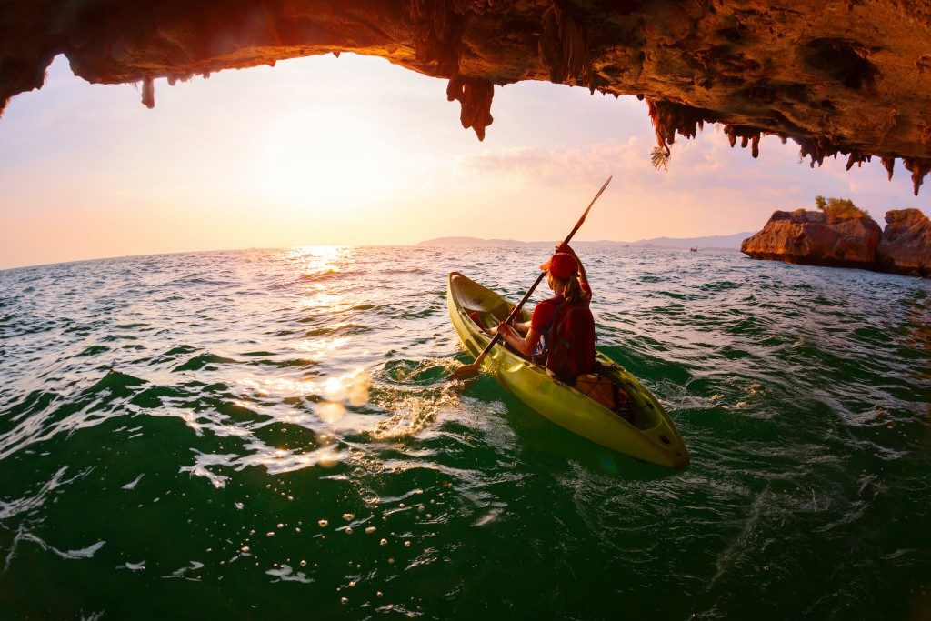 person riding a canoe