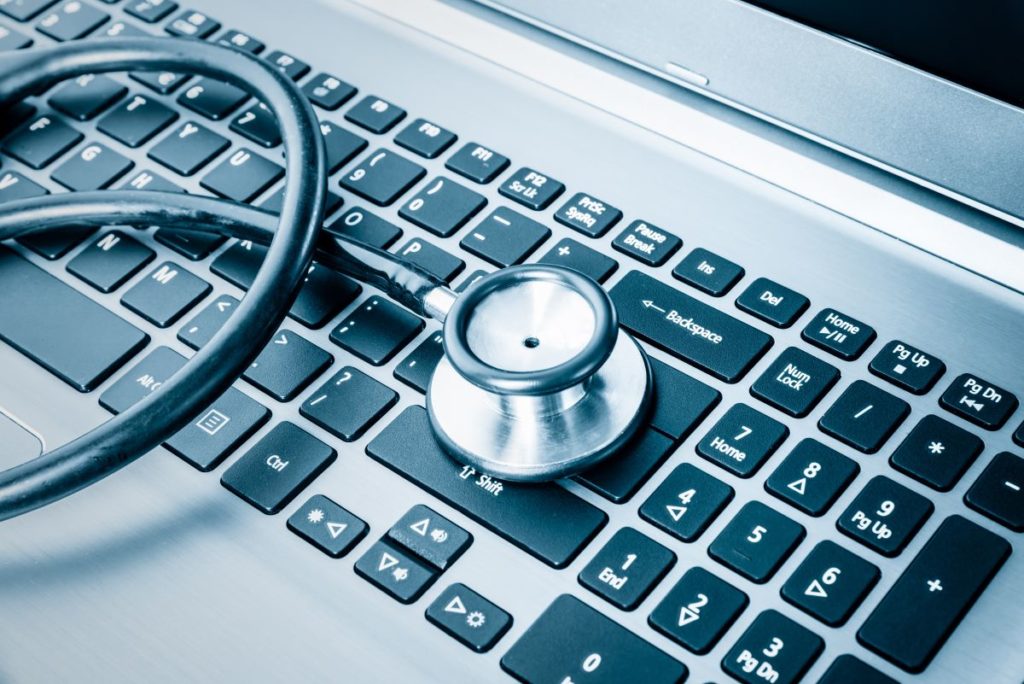 stethoscope on laptop keyboard